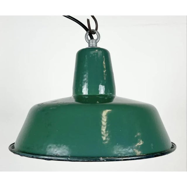 Industrial green enamel pendant light made by Polam Wilkasy in Poland during the 1960s. Hvidt enamel inside the shade....