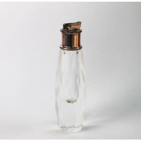 Vintage 1950's crystal cigarette lighter. Tall, heavy, faceted crystal, silver plate top with patina. This high quality...