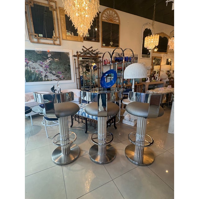 Hard to find set of 3 Design for Leisure LTD. Chrome & Steel Swivel Fluted Barstools Bar Stools. Original upholstery may...