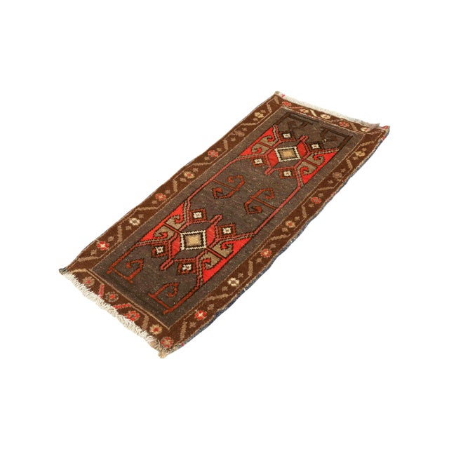 Vintage Handknotted decorative mini rug from Kars region of Turkey. Approximately 45-55 years old. In very good condition.