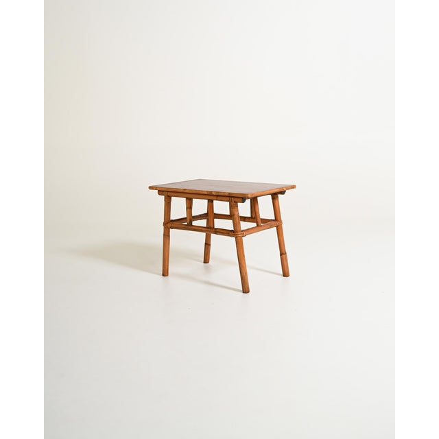 Coffee table with bamboo frame, rectangular wood veneer top, and wicker-finished joints. Scandinavian production, 1960s....