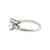 A platinum 1950's bridal ring featuring a repurposed radiant-cut diamond. The diamond weighs 1.28 carats and has a clarity...