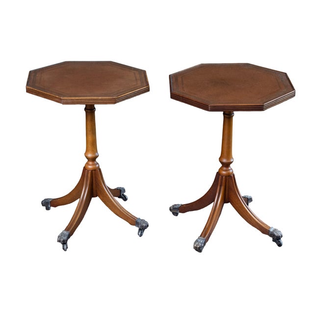 A fine English wine or cocktail table of mahogany from the Edwardian era, featuring a raised edge around the circumference...