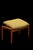 Footstool with an elegant teak frame that is softly shaped with oval legs that give the furniture a unique character. The...
