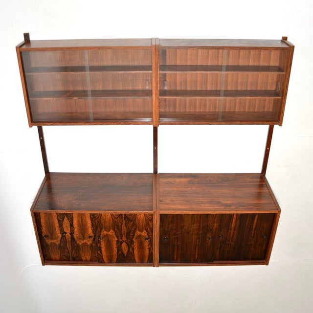 A stylish and versatile Danish vintage wall mounting cabinet by Preben Sorensen. Known as the PS system, this was made in...
