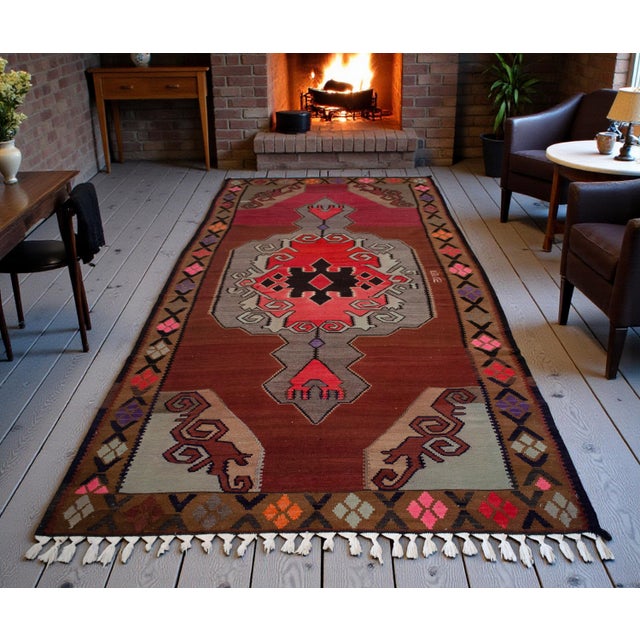 This exceptional 1970s Kars kilim is a remarkable specimen of Eastern Anatolian village weaving, notable for its rare...