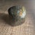 A striking polished piece of natural labradorite, celebrated for its captivating play of color known as labradorescence....