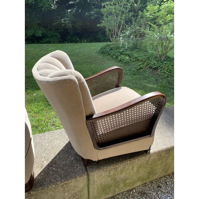 The armchairs are delicate originals from that period. Everything is still original. There are some scratch marks on the...