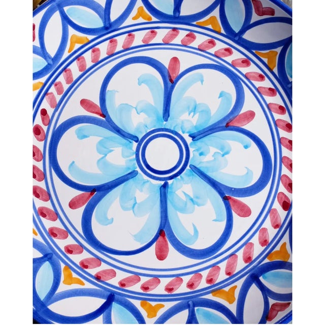 Bright, vibrant and fun hand painted Italian plate. Beautiful colour combination with large floral centre detail. This...