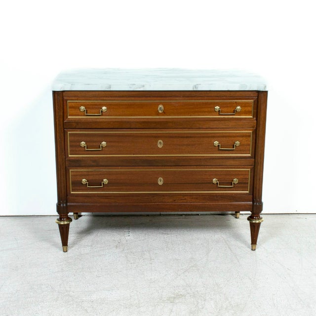 A refined 20th century Parisian commode attributed to the legendary Parisian design firm Maison Jansen, a name synonymous...