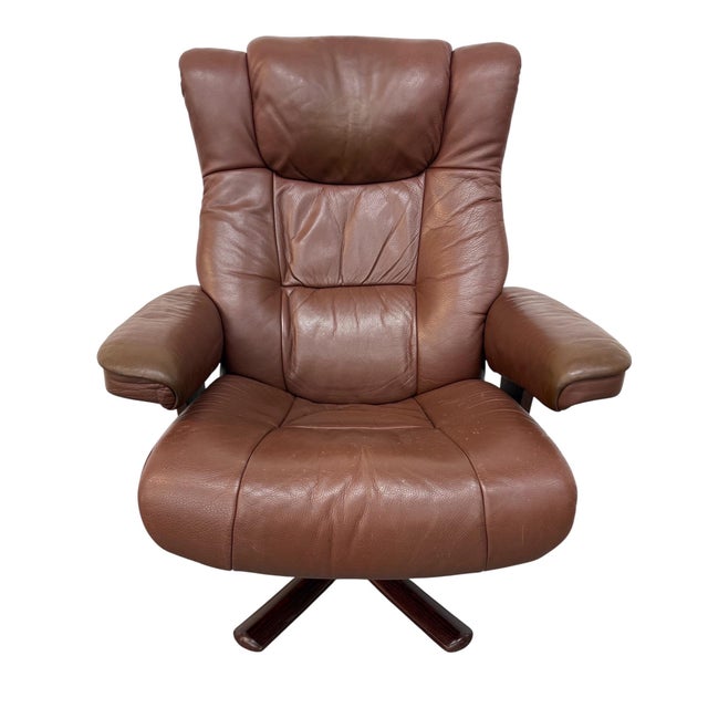Experience classic Scandinavian comfort with this vintage Norwegian leather lounge chair and matching ottoman. Crafted...