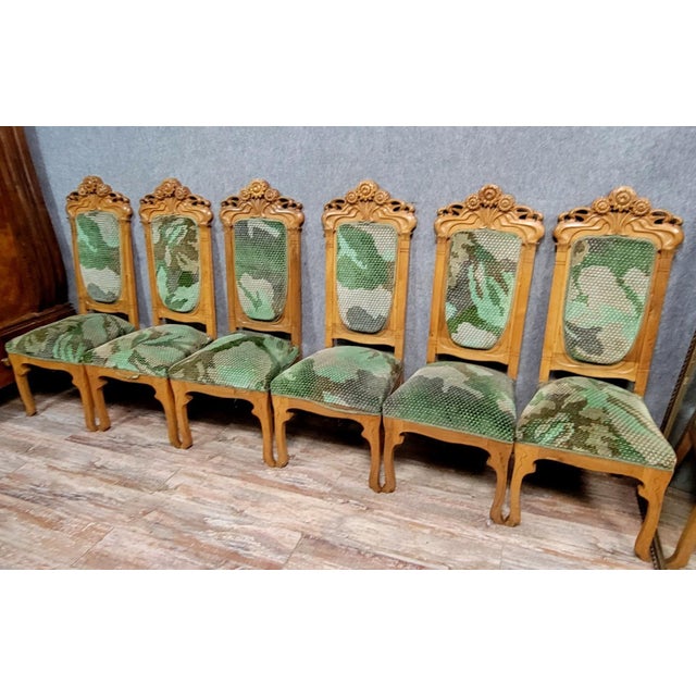 In the style of Alfonso Mucha: a rare set of Art Nouveau chairs circa 1900 Upholstered in floral prints High backs topped...