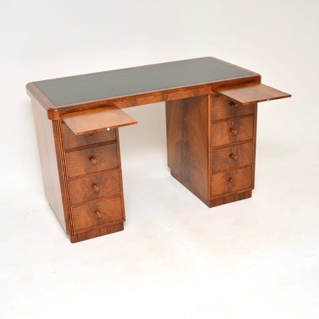A superb Art Deco figured walnut pedestal desk, made in England and dating from the 1930’s. This is of amazing quality, it...