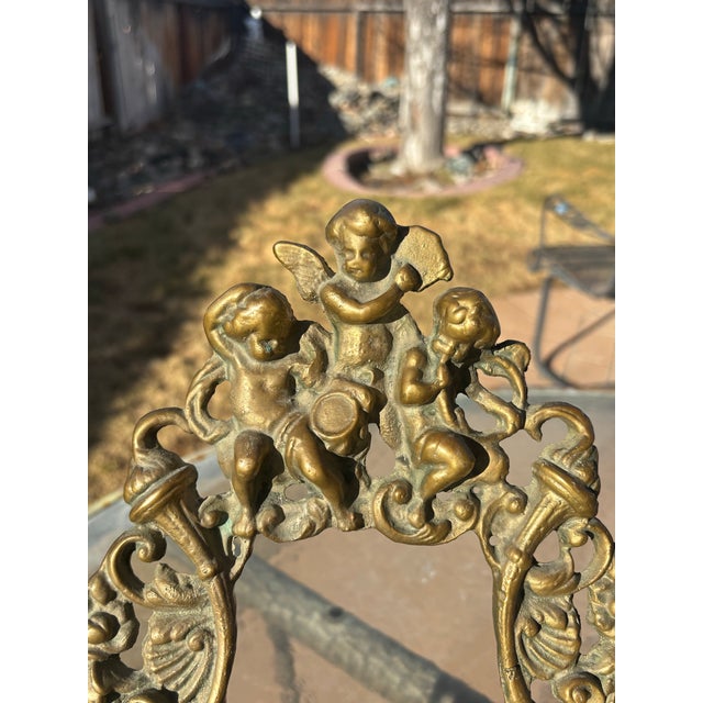 Victorian Brass Frame with Cupids on top and Mythical Creatures on the bottom. This frame is in really good condition with...