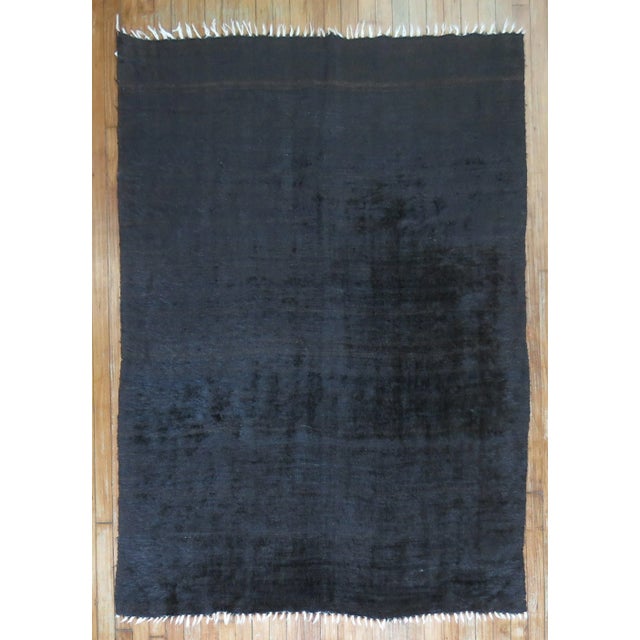 20th Century one of a kind Hand-Knotted Turkish Mohair Wool Rug in Solid black with some think brown stripes on 1 end....