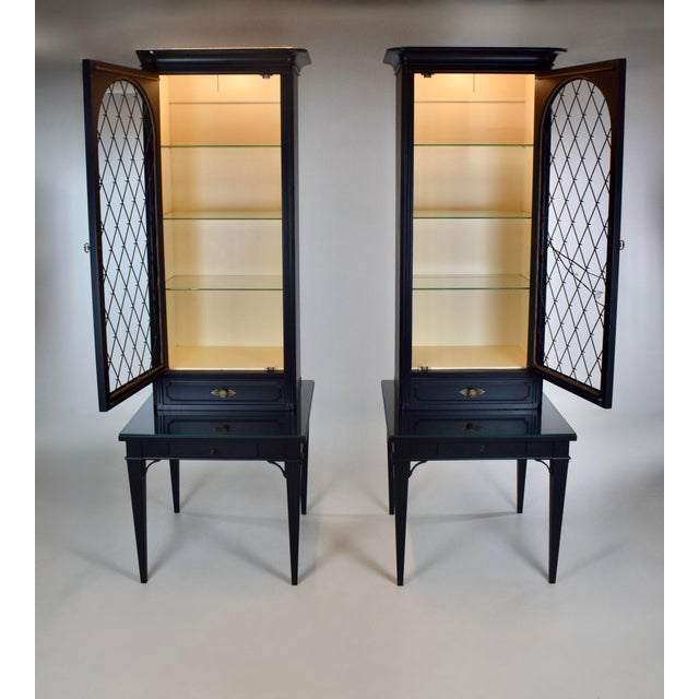 A pair of exquisite, symmetrical etagere vitrine bookcase or curio cabinets showcasing brass diamond pattern lattice...
