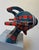 Ray Gun 922 features a dynamic sculptural form that merges playful design with bold patterns. The use of wood, foam, and...