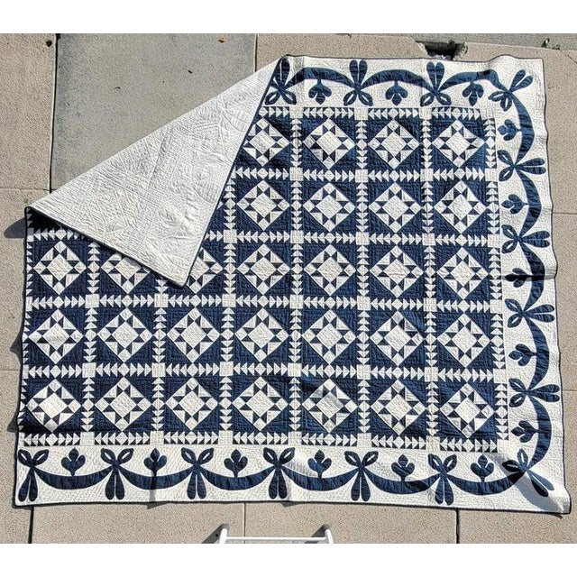 19Thc Eight point star quilt in blue & white with a swag border in pristine condition.Note the flying geese borders...