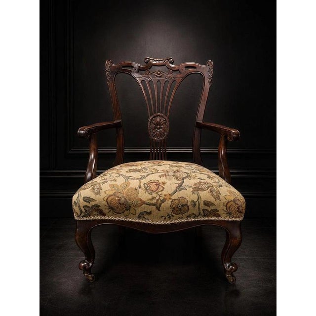 Victorian Carved Mahogany Armchair with Floral Upholstery and Brass Castors For Sale - Image 3 of 6