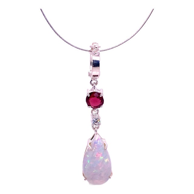 Opal Pendant With Accents of Garnet and Zircon For Sale