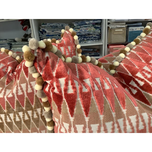 Two down filled 22" square pillows in Kravet Aboca Velvet fabric by Alexa Hampton in a persimmon and beige geometric...
