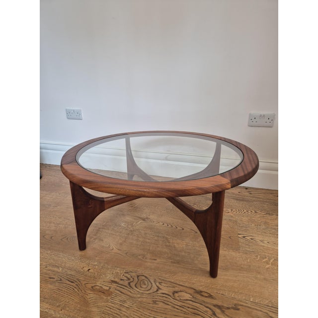 A beautifully sculptural 1960s Stonehill Stateroom teak and glass coffee table, extensively restored and presented in...