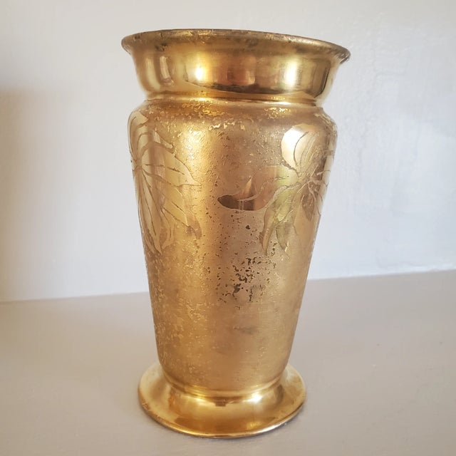 Beautiful vintage German porcelain vase. Smooth abstract poinsettas and leaves decorate the outside of the textural gold...