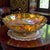 This vintage oval footed iridescent Carnival Glass fruit bowl centerpiece is a stunning piece of American-made decorative...