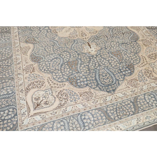 A mid 20th Century Persian Tabriz Room Size carpet in blues and creams