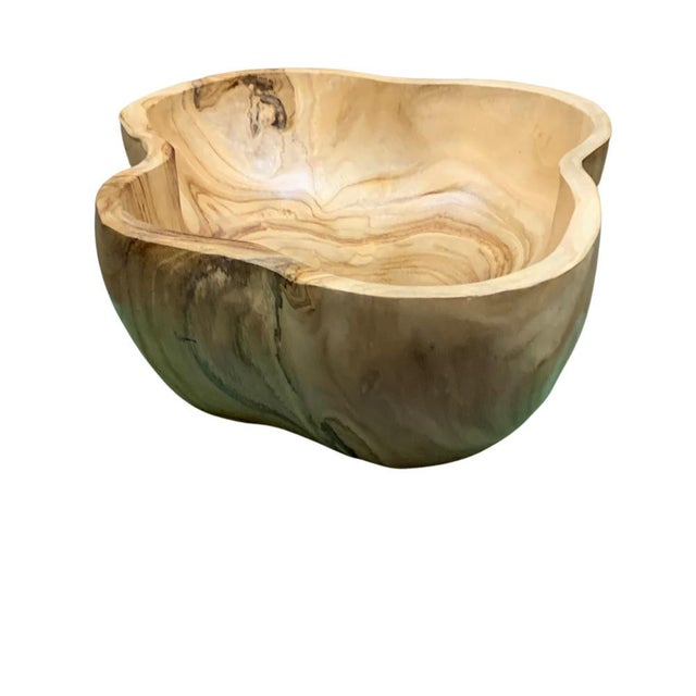 This teak live edge bowl is a unique piece showcasing the natural beauty of teak wood. Crafted by skilled artisans, its...