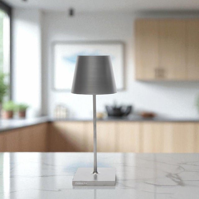 Battery-operated and rechargeable portable table lamp. The lamp features dimming touch control and has 3-CCT color...