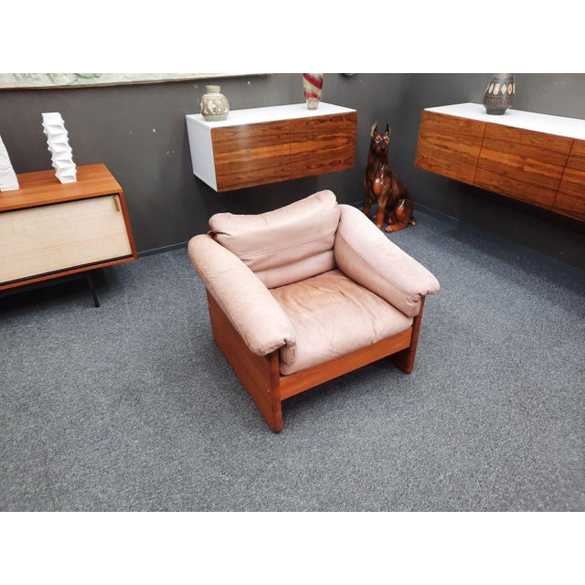 High-quality armchair by A. Mikael Laursen. Solid teak frame with original leather cushions. The armchair was manufactured...