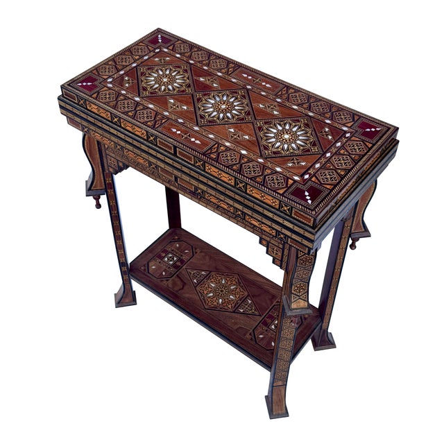 A magnificent handcrafted Syrian marquetry games table featuring extraordinary craftsmanship and timeless design. This...