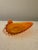 Vintage amber pressed-glass decorative bowl featuring a sculptural peacock design, with the bird's dramatic fanned tail...