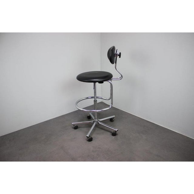 An adjustable vintage office chair manufactured in Czechoslovakia during the 1980s, featuring a polished chrome tubular...