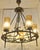 1970s Vintage Rustic Chandelier in Wrought Iron, Brass, and Amber Glass Shades, 1970s For Sale - Image 5 of 9