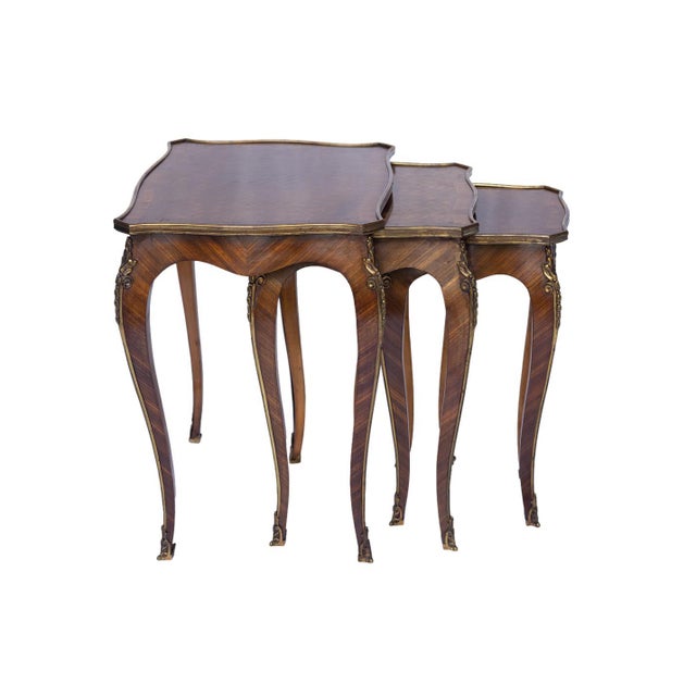 A Suite of Three Louis XV-Style Kingwood and Parquetry Nesting Tables, each with a shaped and banded rectangular top...