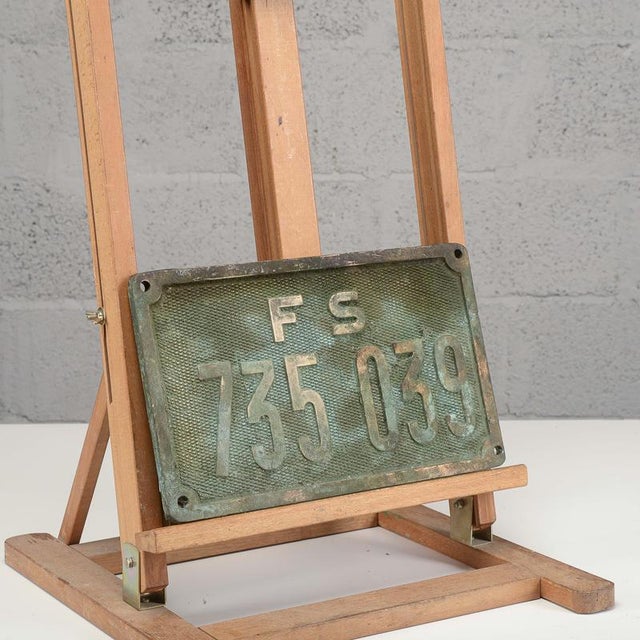 This bronze plaque depicts an original vintage railroad registration plate associated with the historic Ferrovie dello...