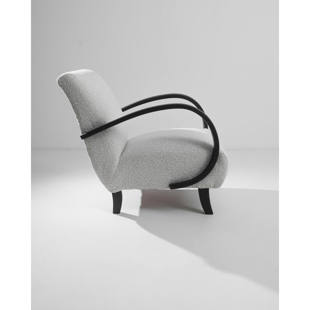 Discover the elegance of the 1960s Czech Wooden Armchair by the legendary J. Halabala. This mid-century marvel features...