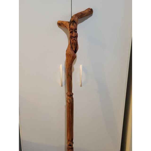 This red wood walking stick is a unique and stylish companion for any outdoor enthusiast. The wood's free-form shape is...