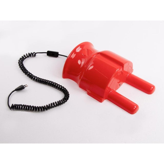Huge red Pop Art plug wall lamp made in Germany in the 1970s. Material: plastic Measurements: : height 16 in. /41 cm,...