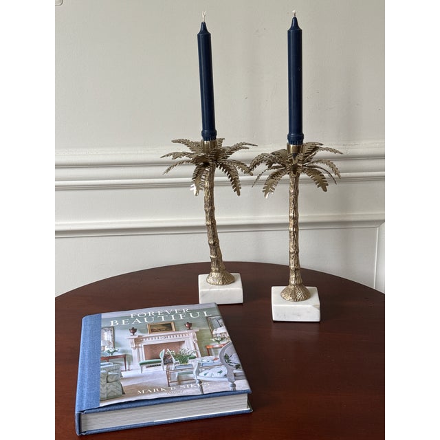 In the style of Michael Aram, this pre-loved pair of candle holders is for anyone who enjoys mixed materials and palm...