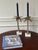 In the style of Michael Aram, this pre-loved pair of candle holders is for anyone who enjoys mixed materials and palm...
