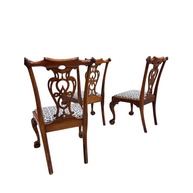 These elegant English Chippendale-style dining chairs showcase timeless craftsmanship and graceful period-inspired design....