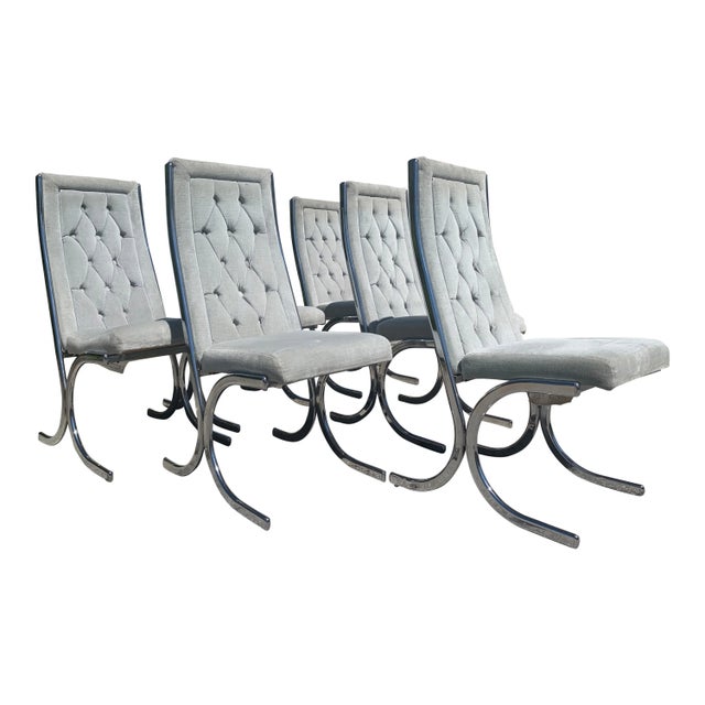 Stunning set of 6 chrome cantilevered dining chairs will soft blue tufted velvet. These chairs were designed by Milo...