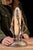 Art Deco figural table lamp featuring three stylized female figures arranged symmetrically around a central illuminated...