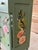 A whimsical custom-painted and decoupaged four-drawer chest nightstand featuring an enchanting collection of tropical...