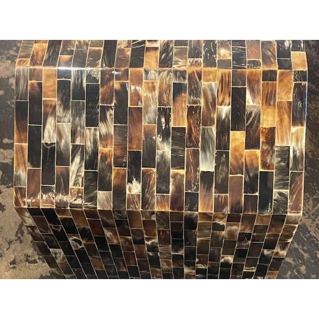 The Mid Century Modern Tessellated Horn Console is a stylish and unique piece of furniture that adds a touch of retro...