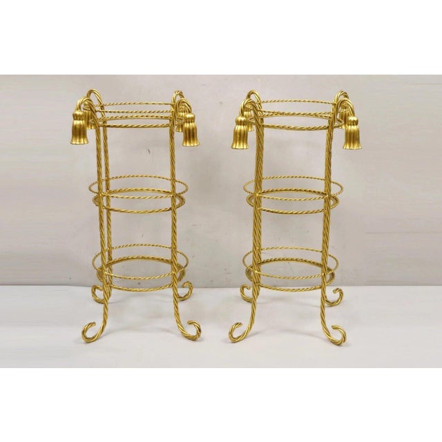 Vintage Italian Hollywood Regency 3 Tier Gold Iron Rope Tassel Stand Side Tables - a Pair. Item features 3 round tiers...