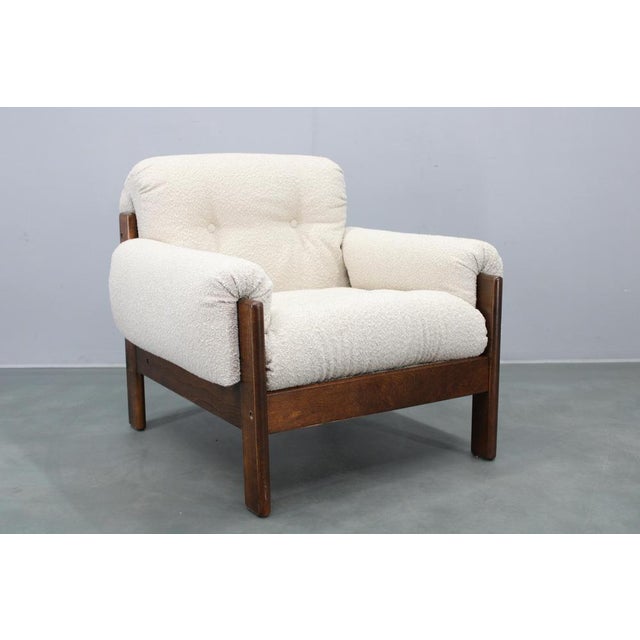 A refined Mid Century armchair produced in Czechoslovakia during the 1970s, featuring a solid stained beech wood frame and...